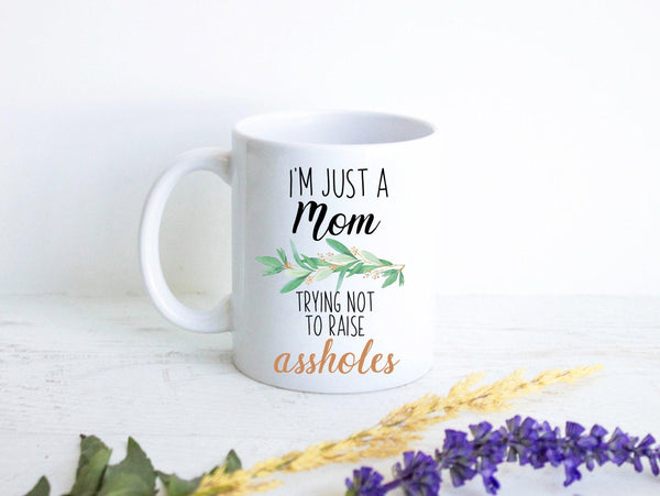 I'm Just a Mom Trying Not To Raise Assholes Greenery - White Ceramic Mug